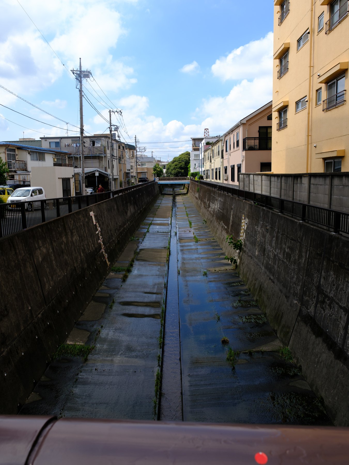 A quiet Tokyo canal photographed as a Fujifilm RAW workflow example