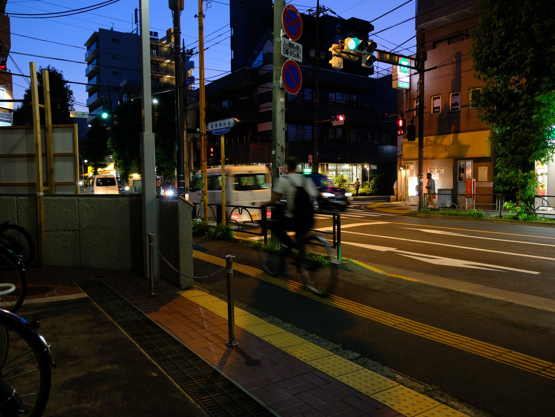 A Tokyo night street color graded with restrained warm and cool tones